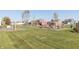 Community playground with swing sets, slides, and various play structures on a grassy lawn at 2761 Winding Creek Ln, Greenfield, IN 46140