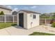 Backyard storage shed surrounded by a lush lawn and a privacy fence at 2761 Winding Creek Ln, Greenfield, IN 46140