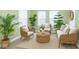 Bright sunroom with wicker furniture, neutral tones, and lots of plants at 2761 Winding Creek Ln, Greenfield, IN 46140