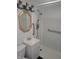 Bathroom with walk-in shower, grab bars, gold mirror, and modern fixtures at 2855 Walker Ave, Indianapolis, IN 46203
