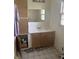 Bathroom with single sink, vanity, mirror, and tile flooring, in need of renovation at 2928 Cicero Rd, Noblesville, IN 46060