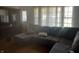 Cozy living room featuring a large sectional sofa and ample natural light from the window at 2928 Cicero Rd, Noblesville, IN 46060