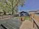 Spacious wooden deck, perfect for entertaining, overlooking a private backyard with a detached blue garage at 2940 N Park Ave, Indianapolis, IN 46205