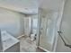 Well-lit bathroom featuring a double sink vanity, a glass-enclosed shower, and modern fixtures at 2940 N Park Ave, Indianapolis, IN 46205