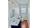 Cozy bathroom featuring modern fixtures, a stylish sink, and wood flooring at 2940 N Park Ave, Indianapolis, IN 46205