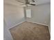 Neutral bedroom featuring plush carpeting, a ceiling fan, and a window that provides plenty of natural light at 2940 N Park Ave, Indianapolis, IN 46205