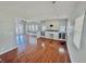 Open-concept living room with hardwood floors, a fireplace, and access to the backyard at 2940 N Park Ave, Indianapolis, IN 46205
