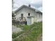 Back view of the property with the deck, small storage room, and an outdoor AC unit at 3031 E 38Th St, Indianapolis, IN 46218
