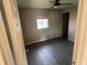 Inviting bedroom with a modern ceiling fan, light gray walls, and durable flooring at 3031 E 38Th St, Indianapolis, IN 46218