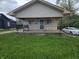 Charming single-Gathering home with a covered front porch and wrought-iron railing at 3031 E 38Th St, Indianapolis, IN 46218
