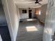 Bright living room featuring gray walls and modern flooring with ceiling fans for added comfort at 3031 E 38Th St, Indianapolis, IN 46218