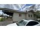 Exterior view showing the side of the house and partial view of the front porch at 3031 E 38Th St, Indianapolis, IN 46218