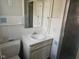 Bathroom features a single vanity and shower with white tile and blue accents at 3128 W 12Th St, Anderson, IN 46011