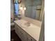 Bathroom features white vanity and tile with floral wallpaper and dark wood floors at 3128 W 12Th St, Anderson, IN 46011