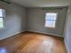 Bedroom offers natural light, hardwood flooring, and neutral-colored walls, ideal for relaxation at 3128 W 12Th St, Anderson, IN 46011