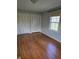Inviting bedroom boasting hardwood floors, a large window, and two double closets for ample storage at 3128 W 12Th St, Anderson, IN 46011