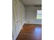 Bedroom boasts hardwood floors and large closets with traditional paneled doors at 3128 W 12Th St, Anderson, IN 46011
