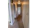 Hallway view showcases neutral carpet leading to doorways and rooms ahead at 3128 W 12Th St, Anderson, IN 46011