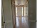 Hallway with neutral paint, tiled floor, and closet at 3128 W 12Th St, Anderson, IN 46011