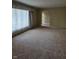 Spacious living room with a large window allowing for natural light at 3128 W 12Th St, Anderson, IN 46011