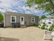 Backyard features a concrete patio area with plastic chairs at 3140 W 18Th St, Anderson, IN 46011