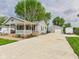 Exterior view showcasing the long driveway leading to the detached garage at 3140 W 18Th St, Anderson, IN 46011