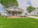Charming single-story home featuring a cozy front porch and well-maintained lawn at 3140 W 18Th St, Anderson, IN 46011