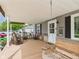 Inviting covered front porch with swing and seating, perfect for relaxing at 3140 W 18Th St, Anderson, IN 46011