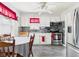Bright kitchen featuring updated stainless steel appliances, white cabinetry, and a dining area at 3140 W 18Th St, Anderson, IN 46011