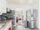 Well-lit kitchen featuring stainless steel appliances and gray tile flooring and backsplash at 3140 W 18Th St, Anderson, IN 46011