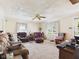 Spacious living room with ample seating, large windows, and neutral carpet at 3140 W 18Th St, Anderson, IN 46011