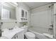 Bright bathroom with a vanity, mirrored cabinet, toilet, and a shower-tub combo with white tile at 3187 Valley Farms Rd, Indianapolis, IN 46214