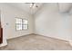 Spacious bedroom features neutral carpet, high ceilings, and a sunny window at 3187 Valley Farms Rd, Indianapolis, IN 46214