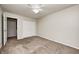 Cozy bedroom featuring neutral carpet flooring, a ceiling fan, and a spacious closet for storage at 3187 Valley Farms Rd, Indianapolis, IN 46214