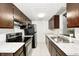 Modern kitchen featuring stainless steel appliances, white subway tile backsplash, and granite countertops at 3187 Valley Farms Rd, Indianapolis, IN 46214