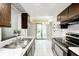 Updated kitchen with stainless steel appliances, granite countertops, and white subway tile at 3187 Valley Farms Rd, Indianapolis, IN 46214