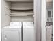 Convenient laundry room with washer, dryer, storage shelves and cabinets at 3187 Valley Farms Rd, Indianapolis, IN 46214