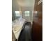Bathroom featuring double sinks, a white toilet, and a shower at 3232 St Jude Dr, Indianapolis, IN 46227