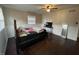 Bedroom featuring hardwood floors, a ceiling fan, and a window at 3232 St Jude Dr, Indianapolis, IN 46227