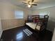Bedroom featuring hardwood floors, a bunk bed, and a window at 3232 St Jude Dr, Indianapolis, IN 46227