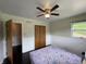 Bedroom featuring hardwood floors, ceiling fan, and a closet at 3232 St Jude Dr, Indianapolis, IN 46227