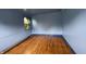 Empty bedroom featuring wood floors, natural light, and neutral walls at 3232 St Jude Dr, Indianapolis, IN 46227