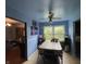 Cozy dining room featuring a ceiling fan, large window overlooking the yard, and room for four at 3232 St Jude Dr, Indianapolis, IN 46227