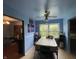 Cozy dining room featuring a ceiling fan, large window overlooking the yard, and room for four at 3232 St Jude Dr, Indianapolis, IN 46227