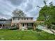 Charming two-story home with a well-maintained lawn, landscaping, and a cozy front porch area at 3232 St Jude Dr, Indianapolis, IN 46227
