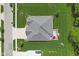 An aerial view of a well-manicured home with large backyard patio and driveway at 3424 S Lookout Pass, New Palestine, IN 46163