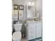Well-lit bathroom featuring a toilet, vanity with a granite countertop, and modern fixtures at 3424 S Lookout Pass, New Palestine, IN 46163