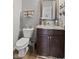 This bathroom boasts a modern vanity, a granite countertop and neutral wall color scheme at 3424 S Lookout Pass, New Palestine, IN 46163