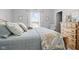 Light and airy bedroom with coastal decor, complemented by an inviting bed and window view at 3424 S Lookout Pass, New Palestine, IN 46163