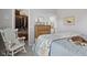 Cozy bedroom featuring a rocking chair and coastal decor at 3424 S Lookout Pass, New Palestine, IN 46163
